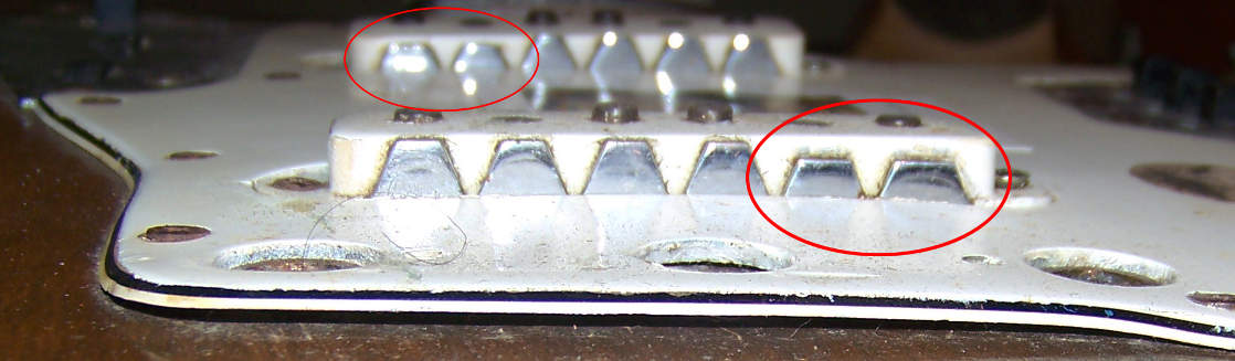 Pickup shielding brackets, one wrong, one right.