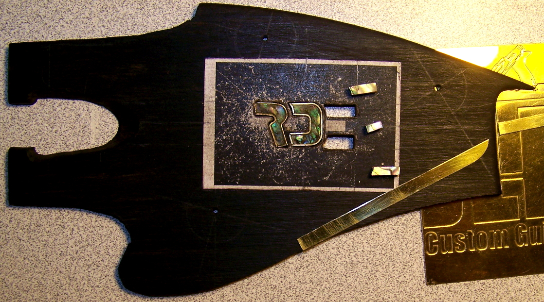 Headstock logo inlay in the making.